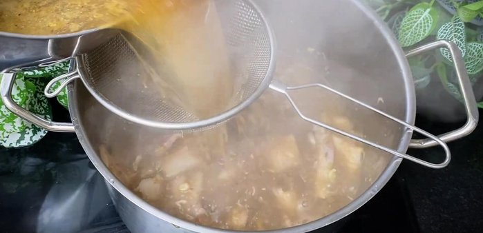 Boil the fish sauce mixture, then simmer over low heat until the bones and fish meat melt. Remove all bones.