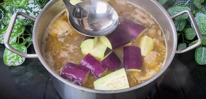 Add eggplant to the hot pot broth.
