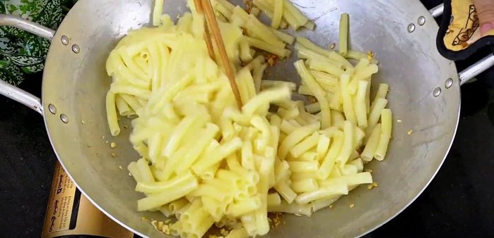 Add stir-fry sauce to coat the noodles. Add the stir-fried beef and vegetables.