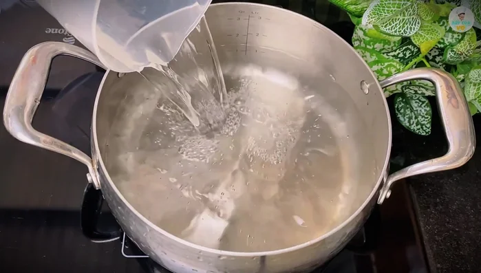 Brew the tea: Boil 1.5 liters of water. Place tea in a sieve or filter bag and add to boiling water. Simmer for 1 minute, then cover and steep for 10 minutes.
