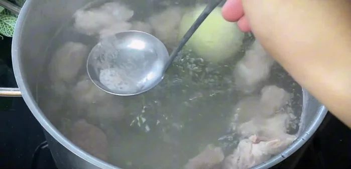 While the tripe boils, prepare the broth: Simmer the pork bone broth for 30 minutes on low heat to extract sweetness and clarify the broth. Skim off foam.