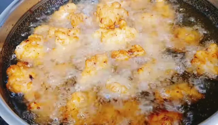 Remove the fried squid rolls and drain excess oil.