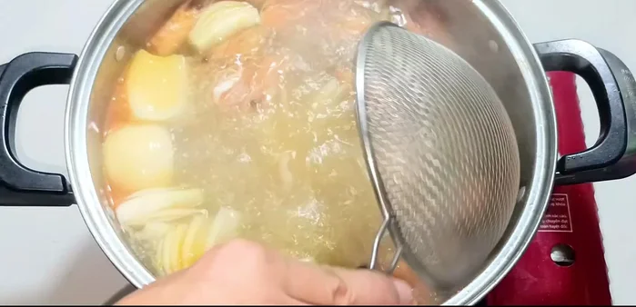 Remove onions and shrimp heads.