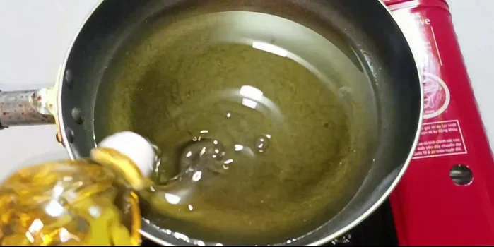Heat enough cooking oil in a pot to cover the potatoes. Reduce heat to below medium.