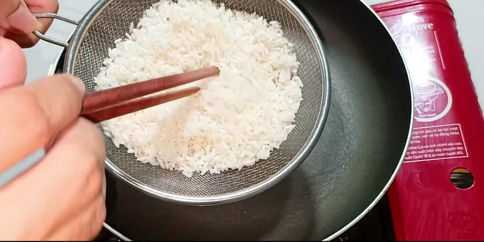 Rinse the rice and roast it in a pan over medium heat until the grains turn opaque white.