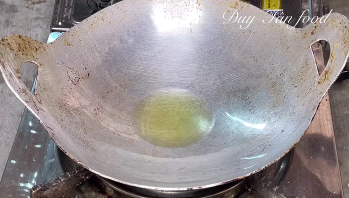 Heat the oil: Heat about half a cup of cooking oil in a small, deep frying pan over medium heat. Once hot, reduce heat to low.