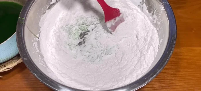 Wear gloves and gently rub the mixture until the flour absorbs the liquid and becomes loose and fluffy. Test the dough; it should hold its shape when squeezed.