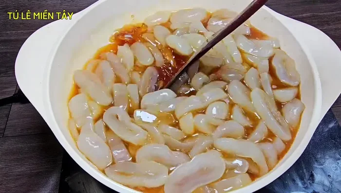 After soaking, cook the mixture over high heat until boiling, then reduce to medium heat. Stir frequently to prevent sticking and ensure even sugar absorption. Cook until the sugar water begins to thicken.