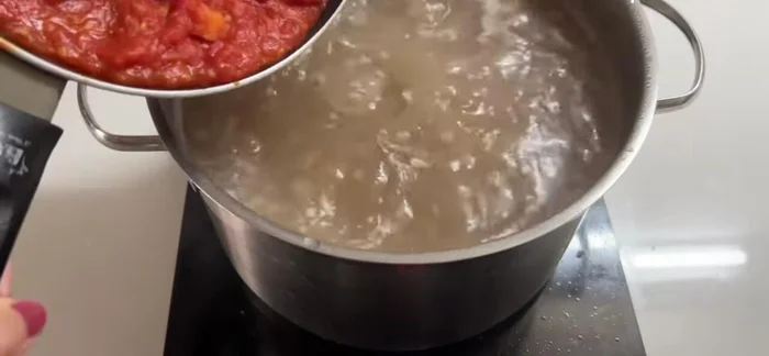 Add the tomato sauce and cook for another 30 minutes. Cover and turn off the stove. Let it sit for 2 hours.