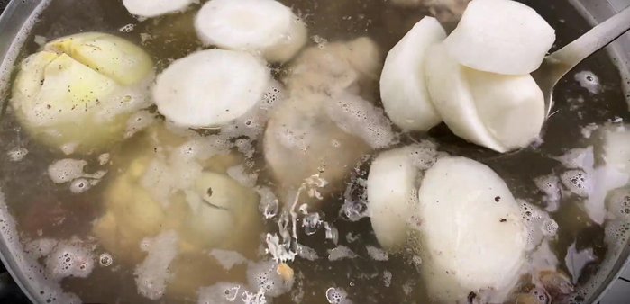 Add the radish: Add the white radish to the broth and continue simmering on low heat.