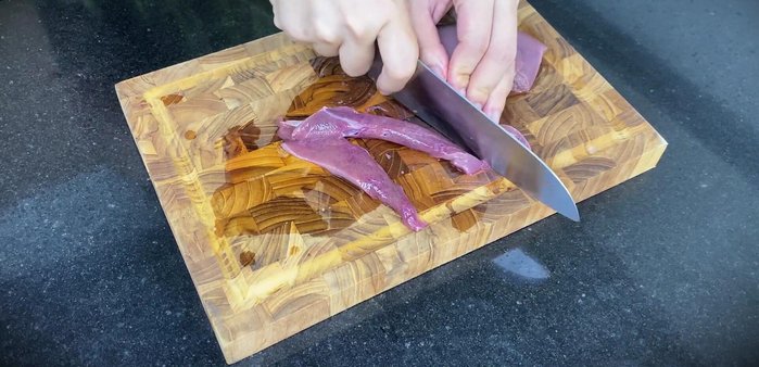 Prepare the meats: Cut the pork, pig heart, and liver into thin, bite-sized pieces. Marinate with seasoning and store in the refrigerator.