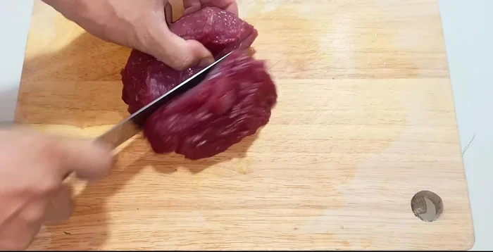 Cut beef across the grain into thin slices to ensure tenderness.