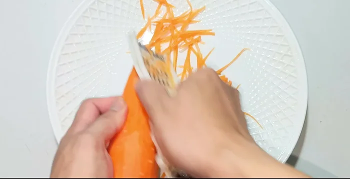 Grate carrots.