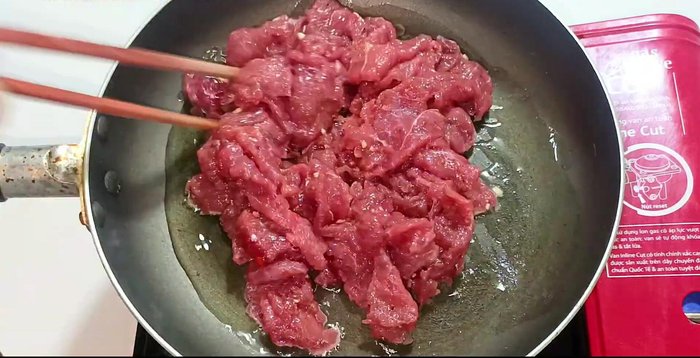 Stir-fry beef over high heat until slightly pink and rare. Do not overcook.