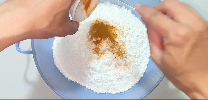 Prepare the batter: In a bowl, combine all-purpose flour, cornstarch, turmeric powder, sugar, and salt. Gradually add water while stirring until a lumpy batter forms. Do not add too much water.