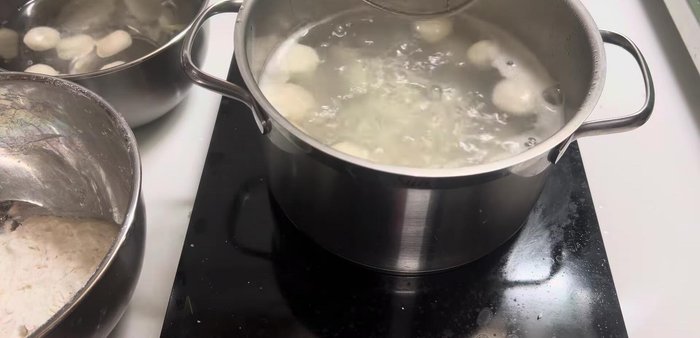Remove the cooked cake balls and immediately place them in cold water to prevent sticking.