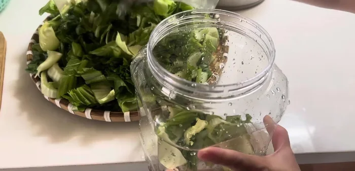 Place the blanched cabbage into small jars.