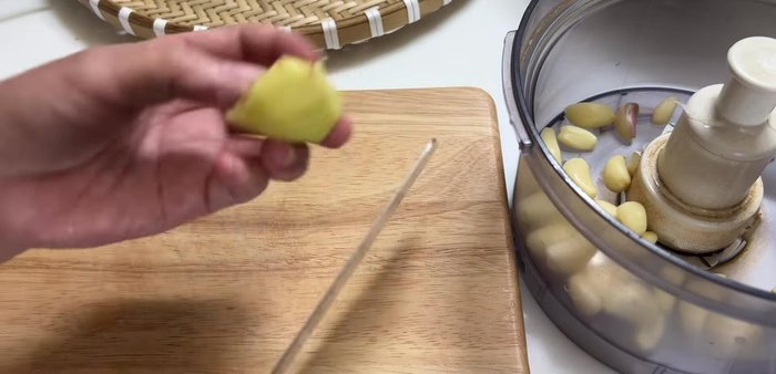 Blend garlic, ginger, onions, green onions, and chives.