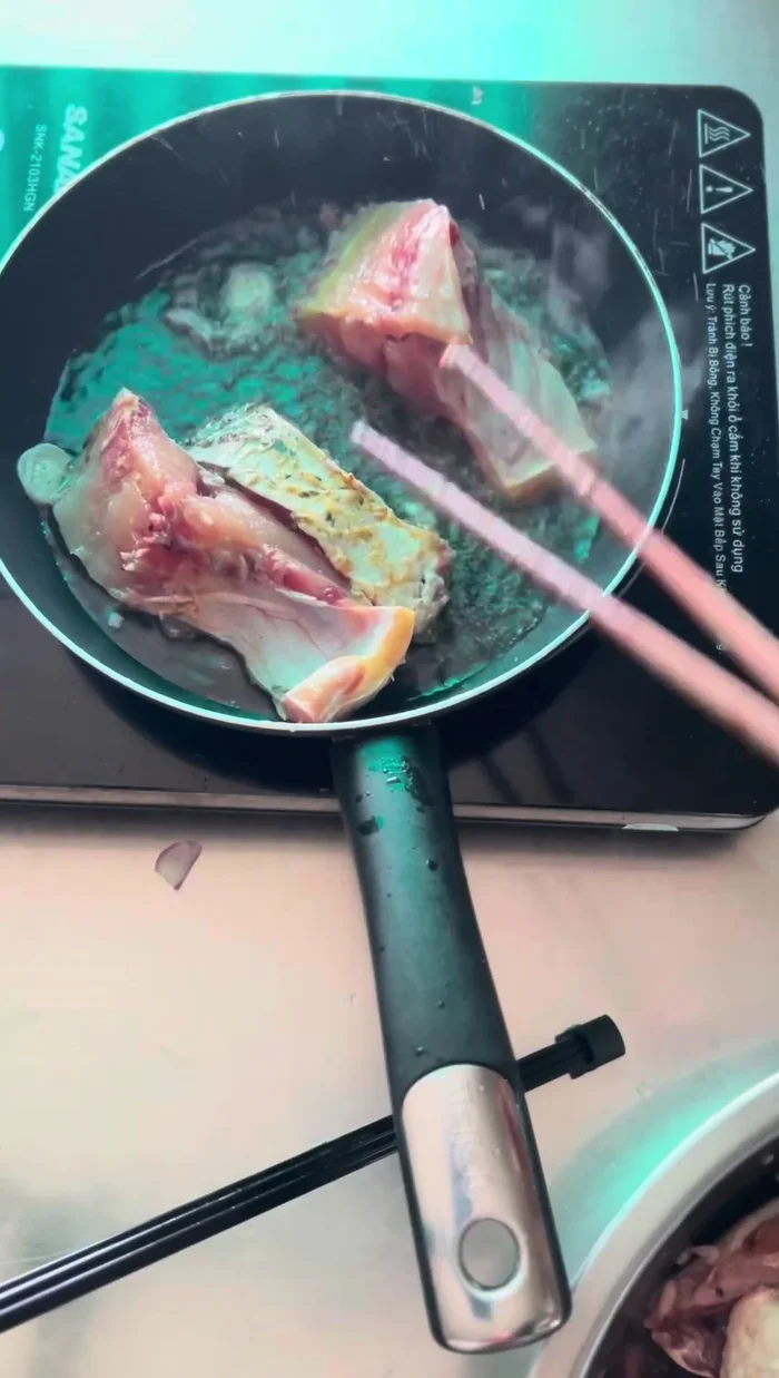 Pan-fry the fish: Heat oil, add onions for flavor, then add the fish and pan-fry for about 1 minute per side.
