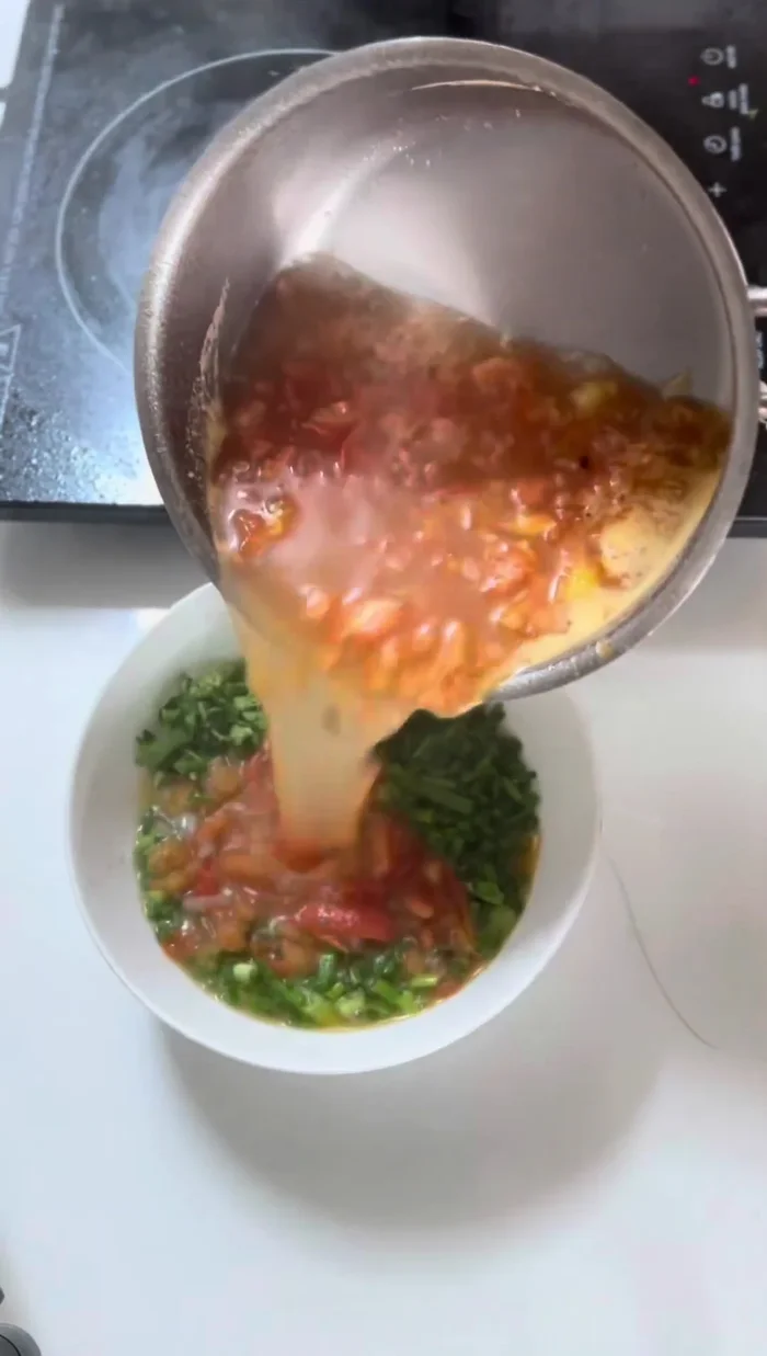 Add bone broth, eggplant water, green onions and cilantro to the tomato sauce. Add tamarind juice and season to taste.