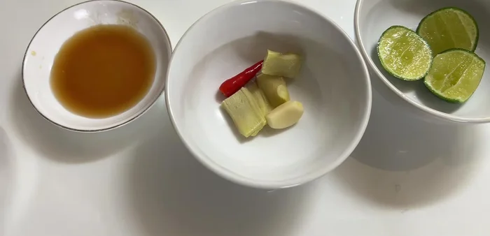 Prepare the ginger fish sauce: Blend or crush ginger, garlic, chili, MSG, sugar, lemon juice, and fish sauce.
