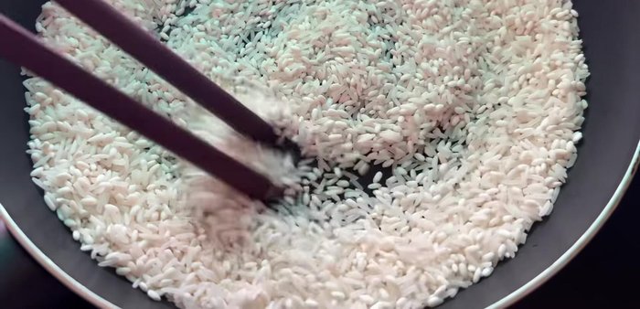 Fry rice until golden brown.