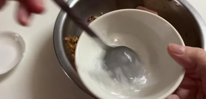 To prevent oil splattering while frying, mix boxed salt with water until dissolved. Pour this mixture over the pork skin before frying.