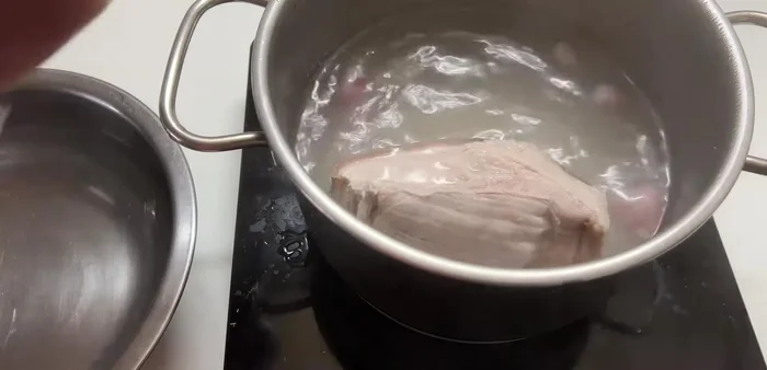 After boiling, plunge the pork belly in cold water to prevent it from turning black.