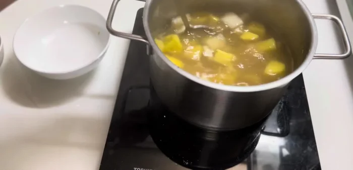 Simmer for another 5 minutes to allow the potatoes to absorb the sugar.