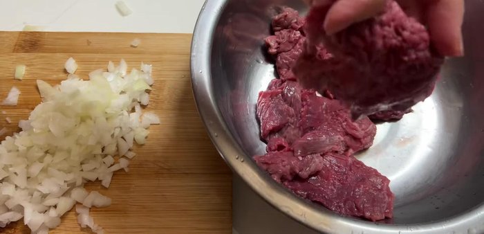 Pound the beef lightly with the back of a knife to tenderize it.