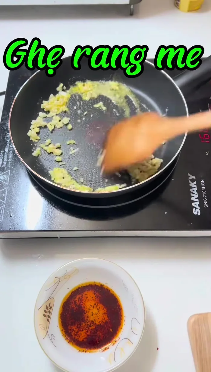 Add the onion and stir well. Add the tamarind juice and cook for about 5 minutes.