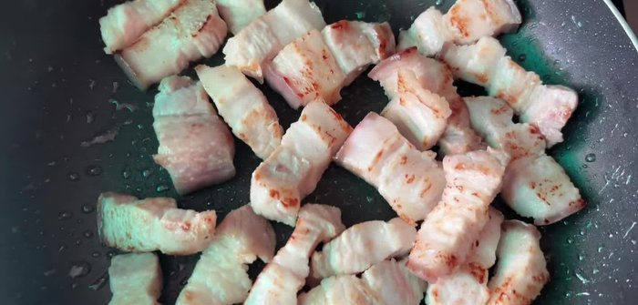 Cut pork belly into pieces. Stir-fry in a pan until some fat is released (about 15 minutes). Do not marinate.