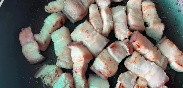Remove the pork belly and reserve the rendered fat. Fry the pork belly until fragrant.