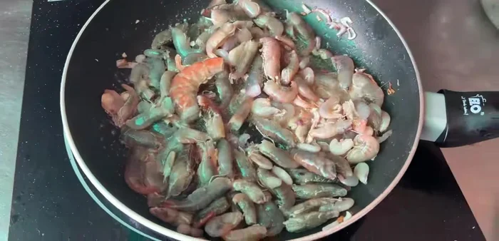 Add the marinated shrimp and stir-fry over high heat for about 5 minutes.