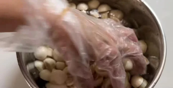 After 3 hours, remove eggplant, rinse twice with water, and drain completely.