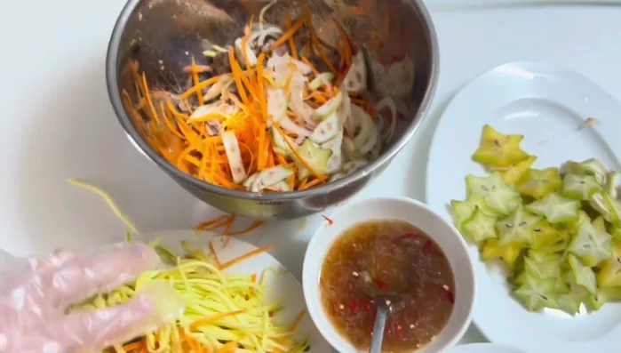 Add the star fruit and mango. Mix well.
