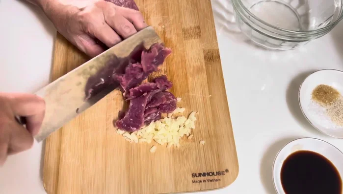 Slice the beef for marinating.