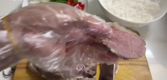 Slice the chilled rare beef thinly.
