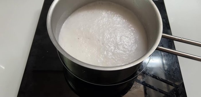 Mix sticky rice flour with the cooled coconut milk mixture (around 50°C). Add more water if needed to reach a soft, pliable dough.