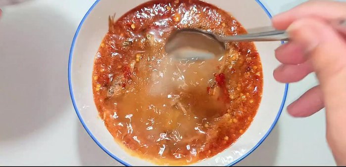 Add the crushed chili and garlic mixture.