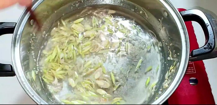 Add 600 ml of water and stir. Add sugar, seasoning powder, MSG, and fish sauce. Stir to combine.