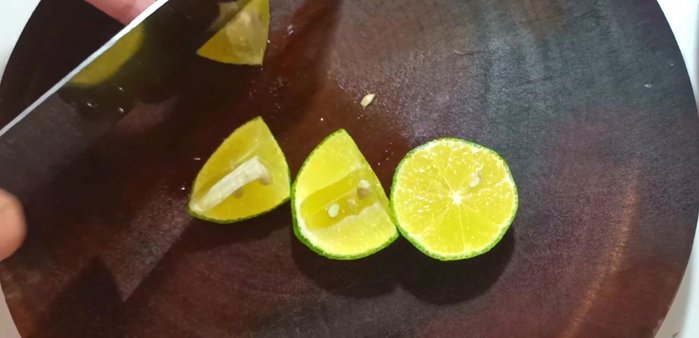 Cut and squeeze the juice from one lemon. Chop 5 chili peppers and 12 cloves of garlic.