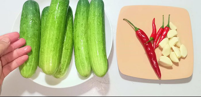 Wash cucumbers thoroughly and use the skin. Choose firm cucumbers of the right size. Cut off both ends, then cut the cucumber in half and remove the seeds.