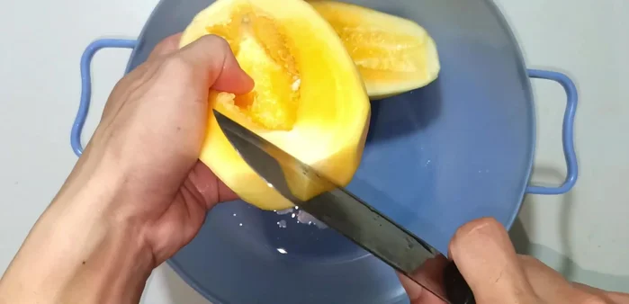 Cut the papaya into thirds or fourths, then thinly slice it.