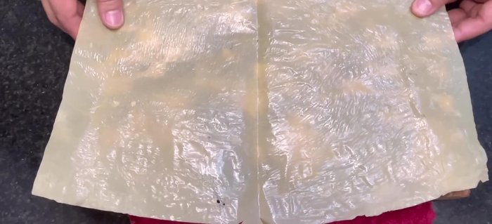 Prepare the taro leaves by cutting off the hard edges.