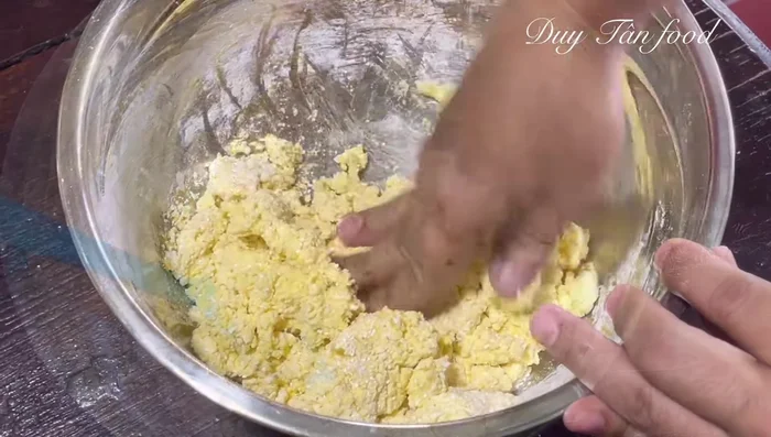 Knead the dough until smooth and elastic. Add a little hot water if too dry, or flour if too wet.