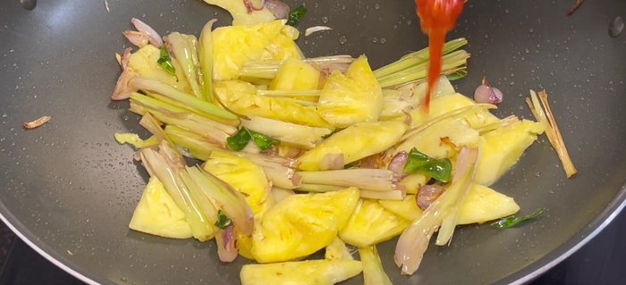Stir in shrimp satay, chili sauce, tomato sauce, and Thai hot pot sauce. Cook until fragrant, reducing heat to medium-low.