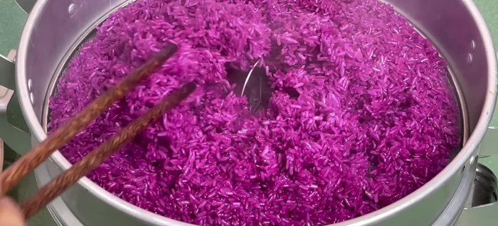 Once the sticky rice is steamed, add it to the hot coconut milk mixture. Stir well to combine and ensure even absorption.