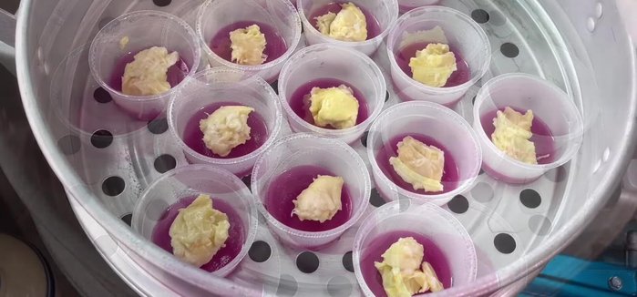 Add durian and green bean filling: Add durian filling in the center, then top with a spoonful of green bean filling.