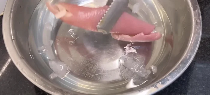 Immediately transfer the boiled skin to iced water to cool and firm it. (158.48)